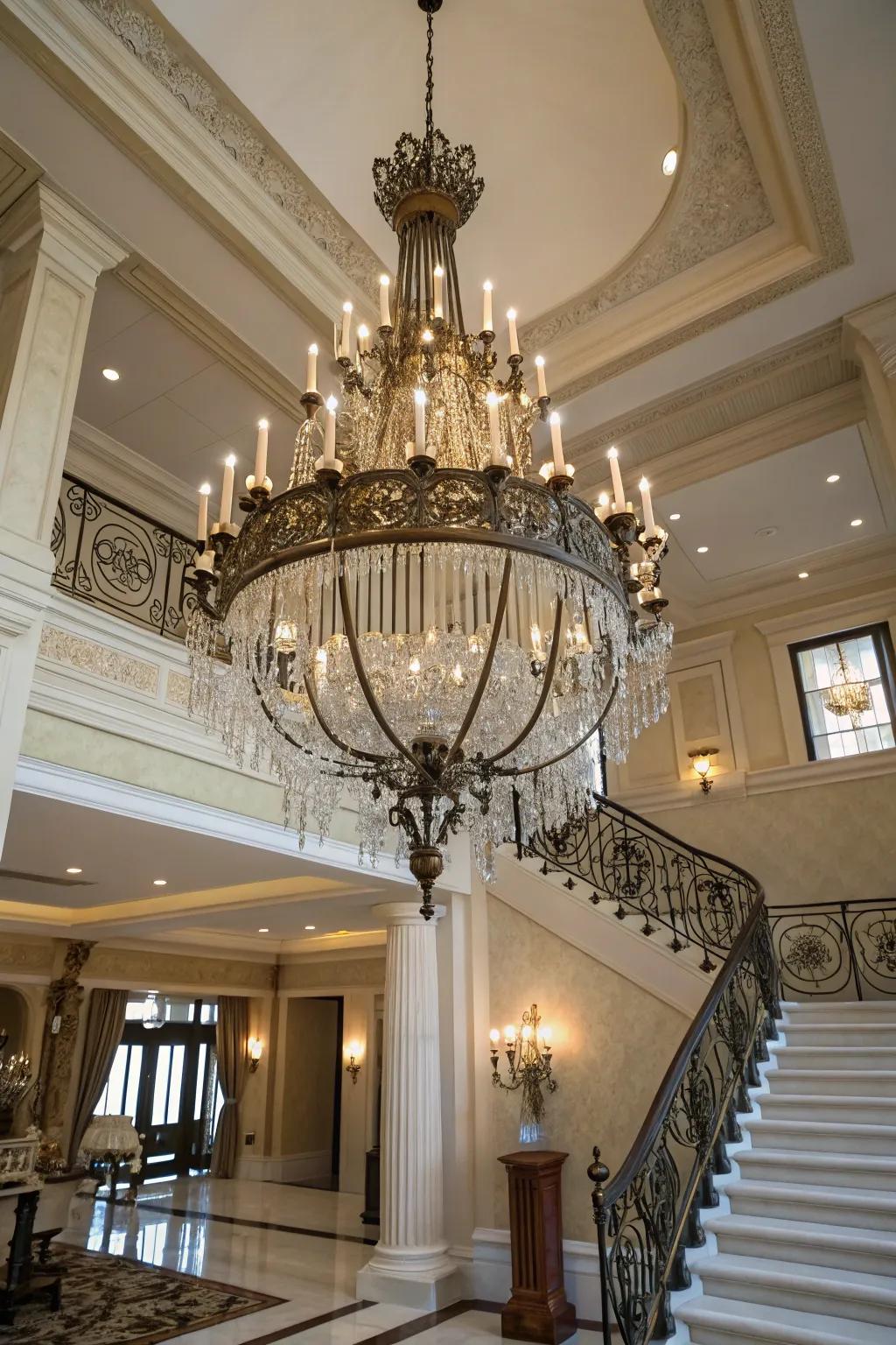 A statement lighting fixture introduces sophistication to an expansive two-story entryway.