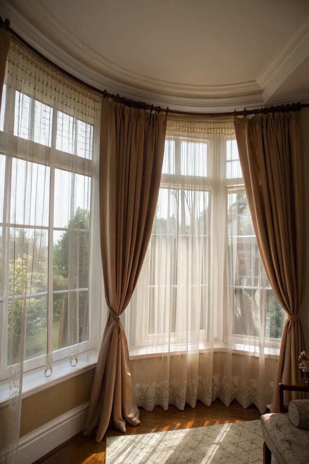 The use of layered curtains brings both style and versatility to your bay windows.