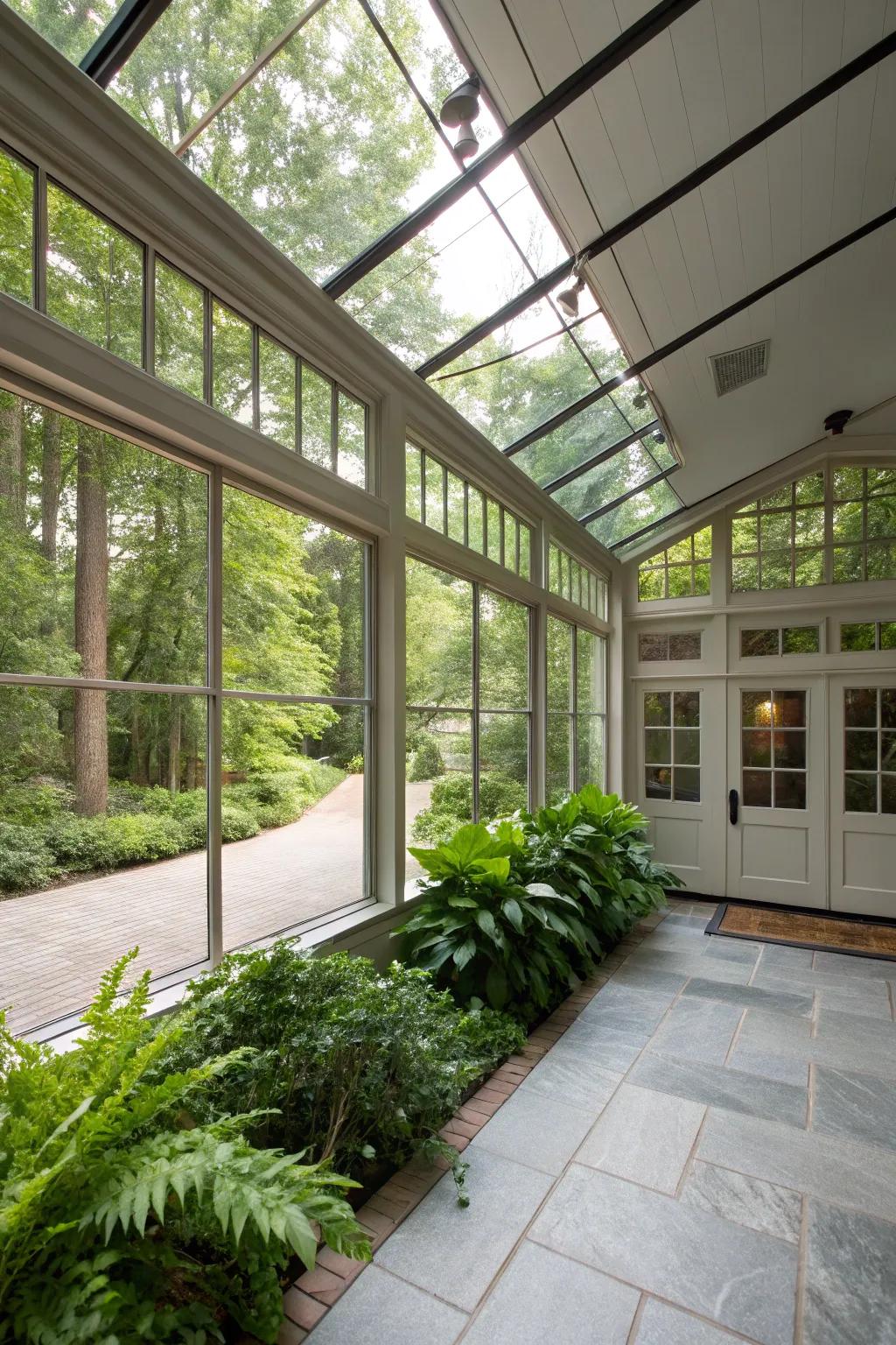 A glass-enclosed breezeway that coaxes the outdoors inward, fashioning a luminous passage from the garage to the home.