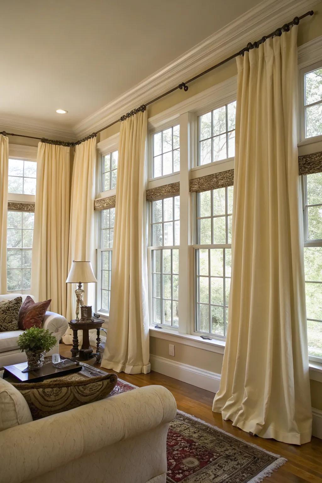 Coordinated curtains provide a sense of unity and sophistication to a room featuring numerous windows.