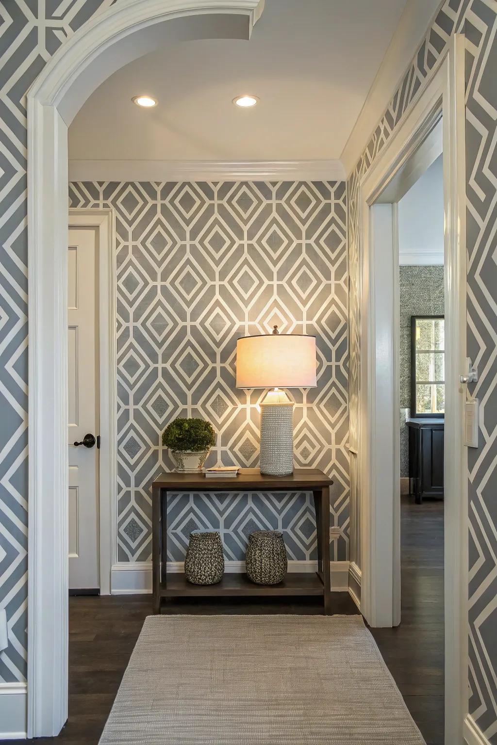 A contemporary entryway showcases bold geometric wallpaper, setting a modern tone.
