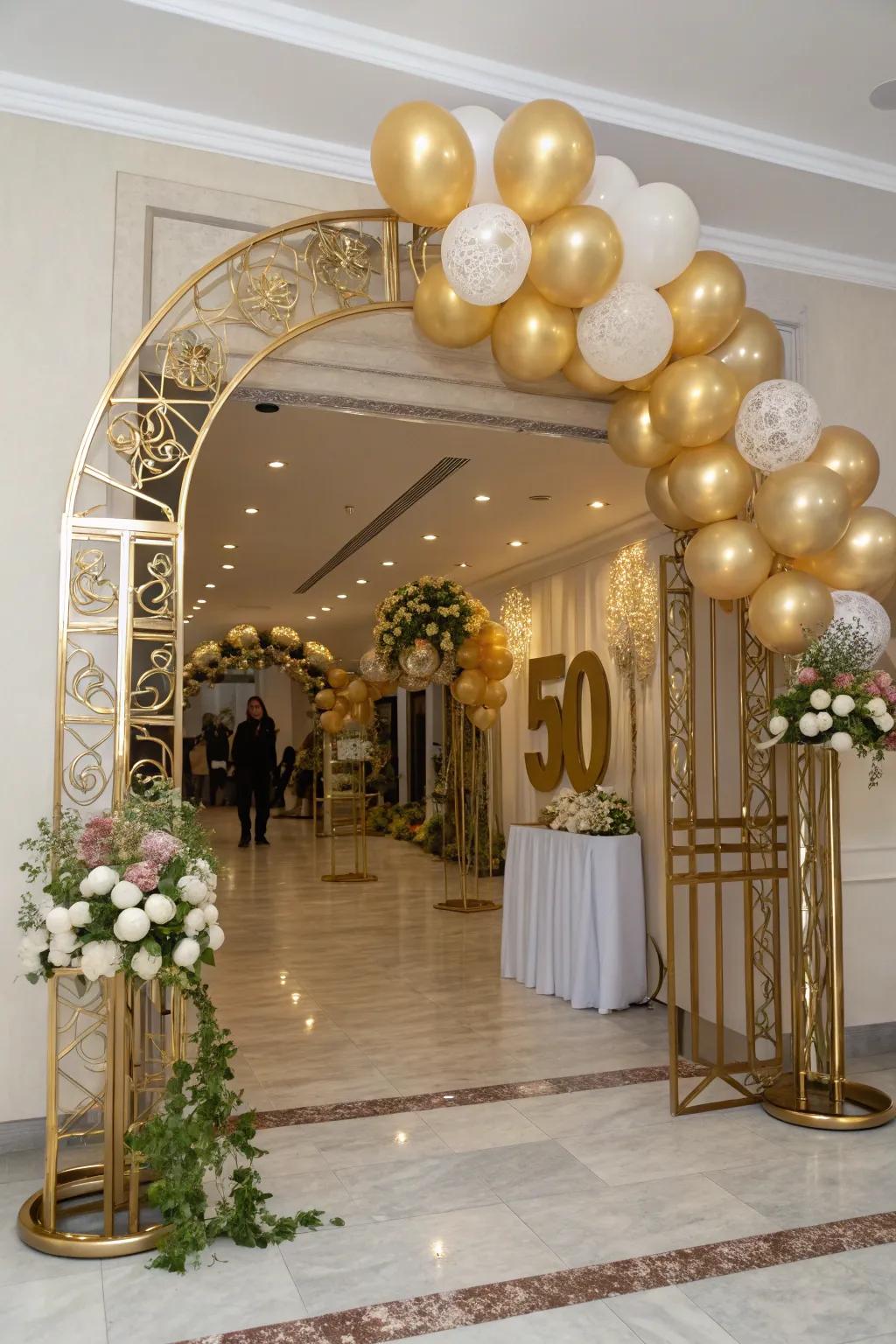 A magnificent gold balloon archway greets guests as they arrive for the party.