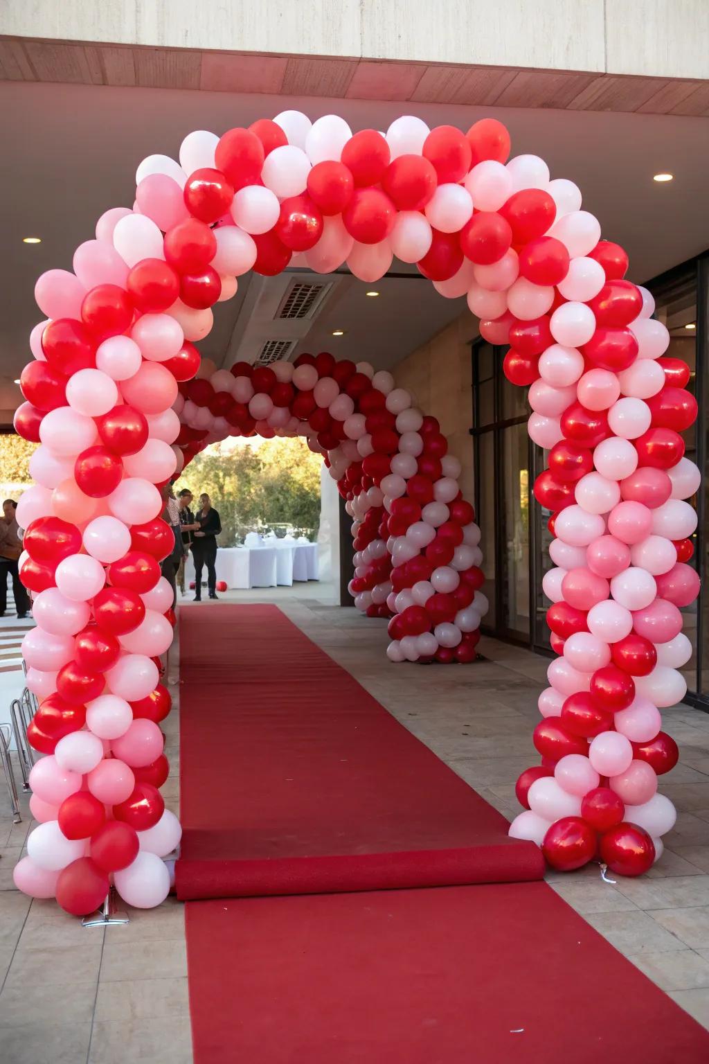 An impressive heart balloon archway fashions an unforgettable entrance for amorous events.