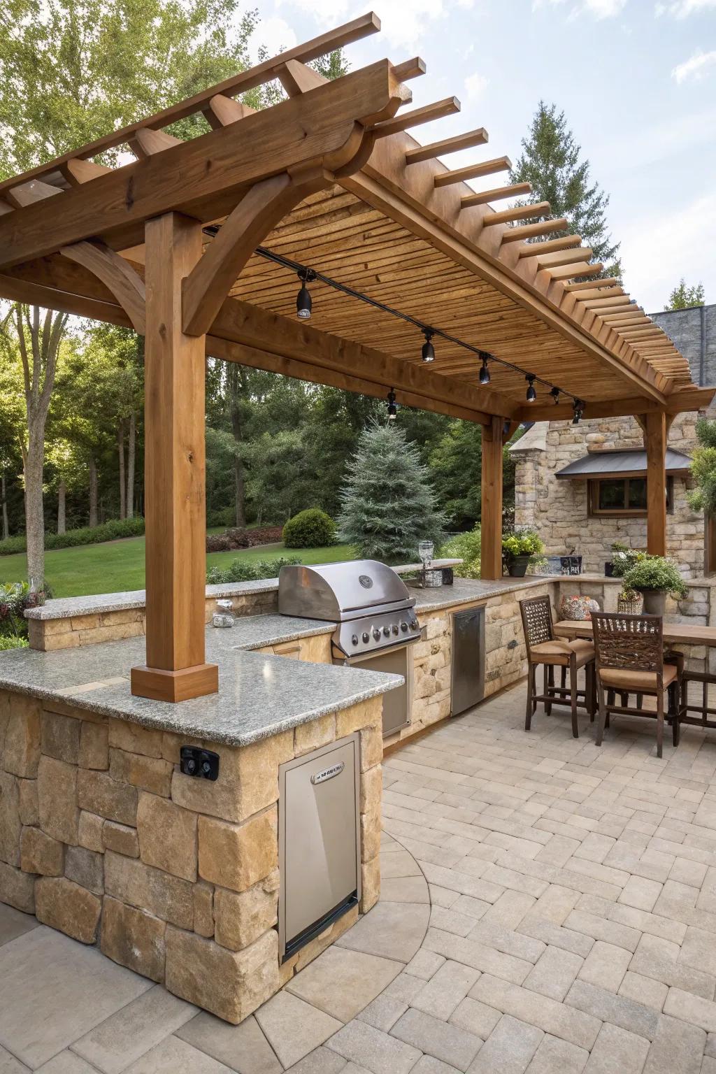 Classic wooden pergola presiding over an outdoor kitchen with a stone countertop.