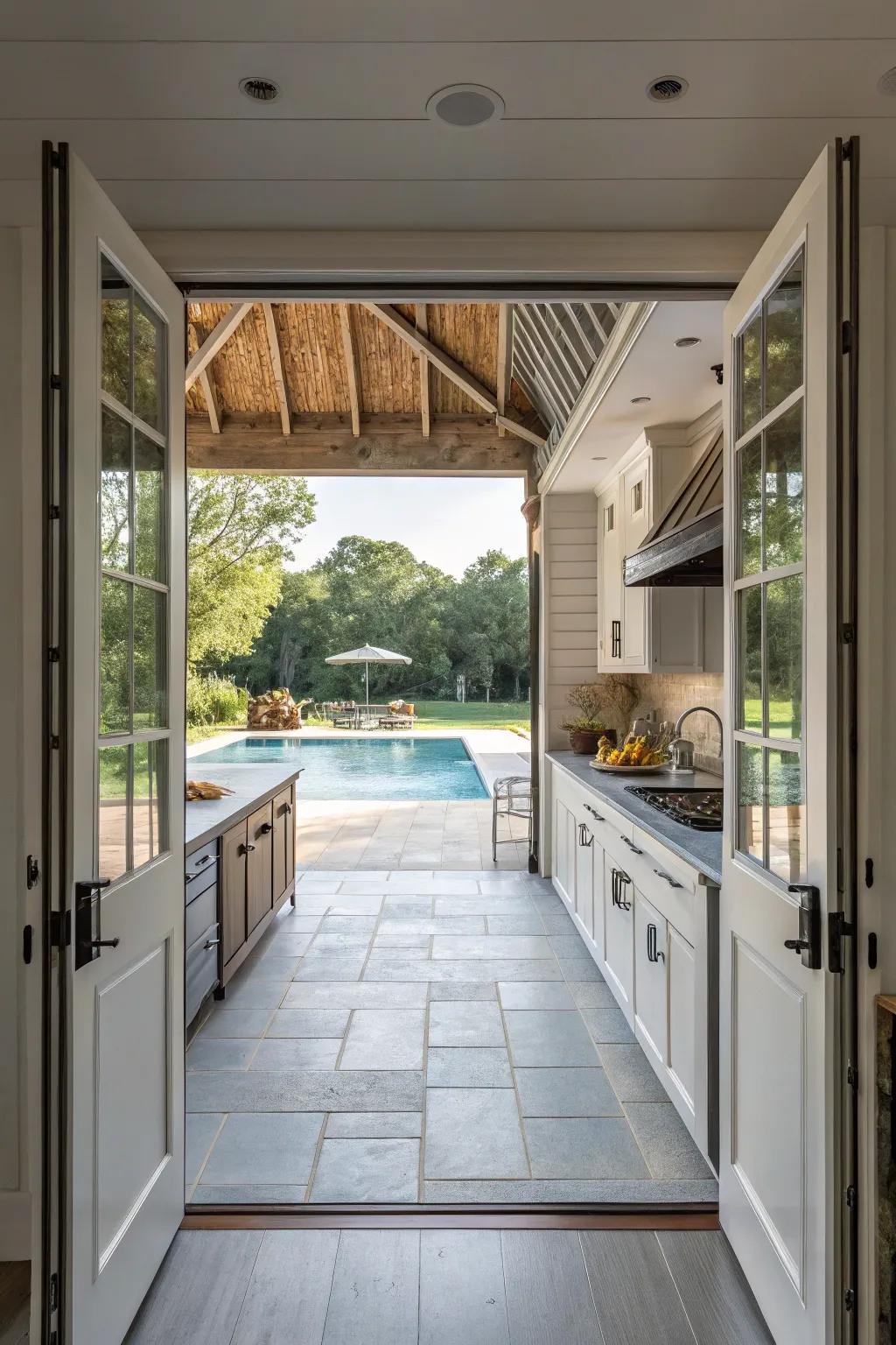 Open-air kitchen design effortlessly connecting with the pool area.