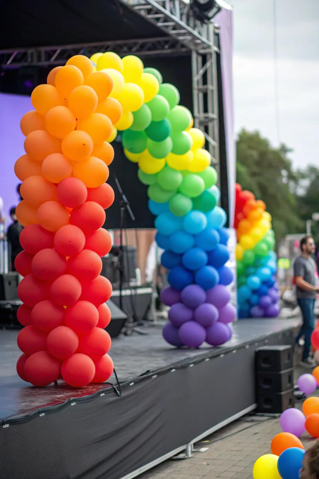 A stage showcasing a rainbow-themed balloon decor arrangement.