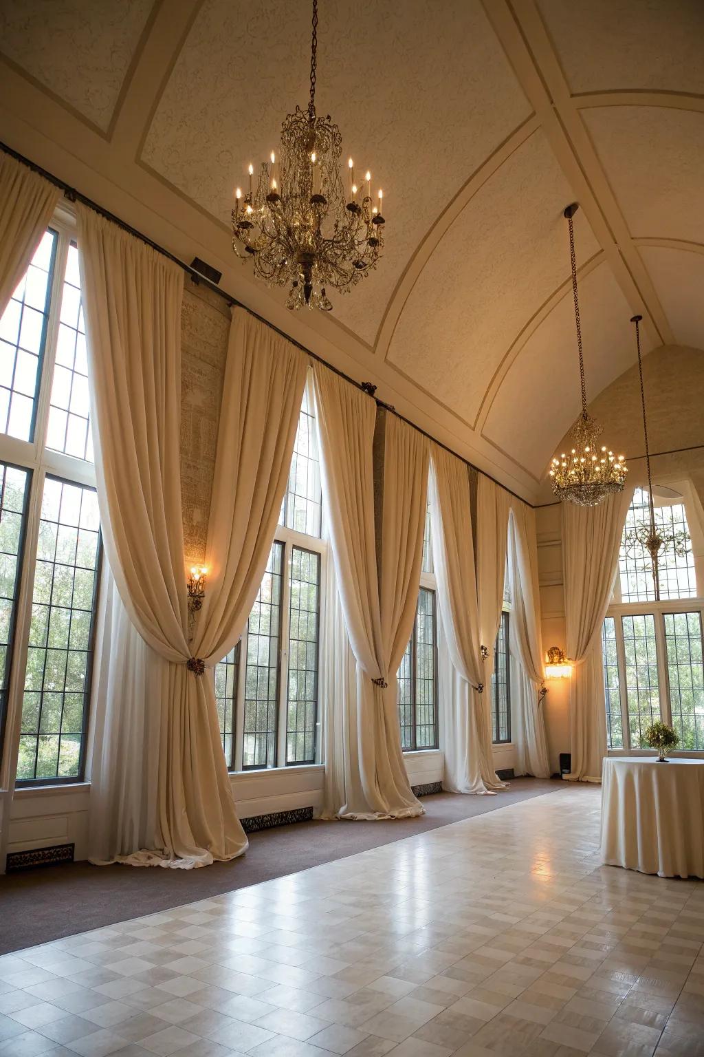 Striking draperies emphasize the height and elegance of the area.