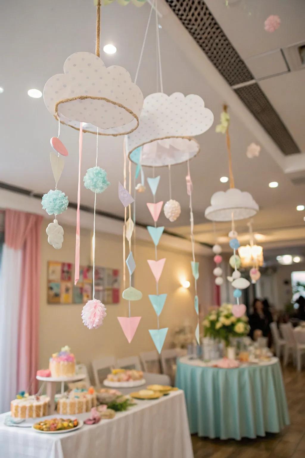 Bespoke sky mobiles contribute a handmade, whimsical detail to the baby shower décor.