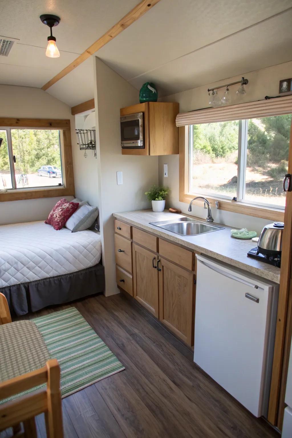 A streamlined guest quarter featuring a bed and small cooking corner, affording a welcoming space for visitors.