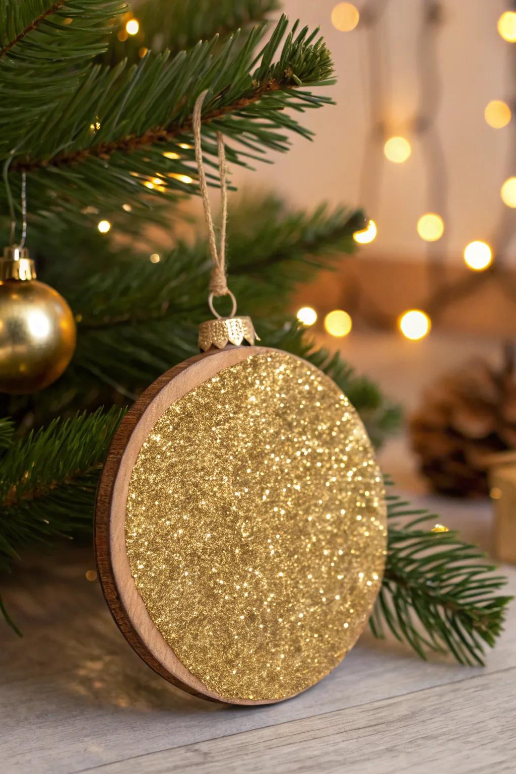 This wood decoration has been turned into a festive treasure by the addition of gold glitter.