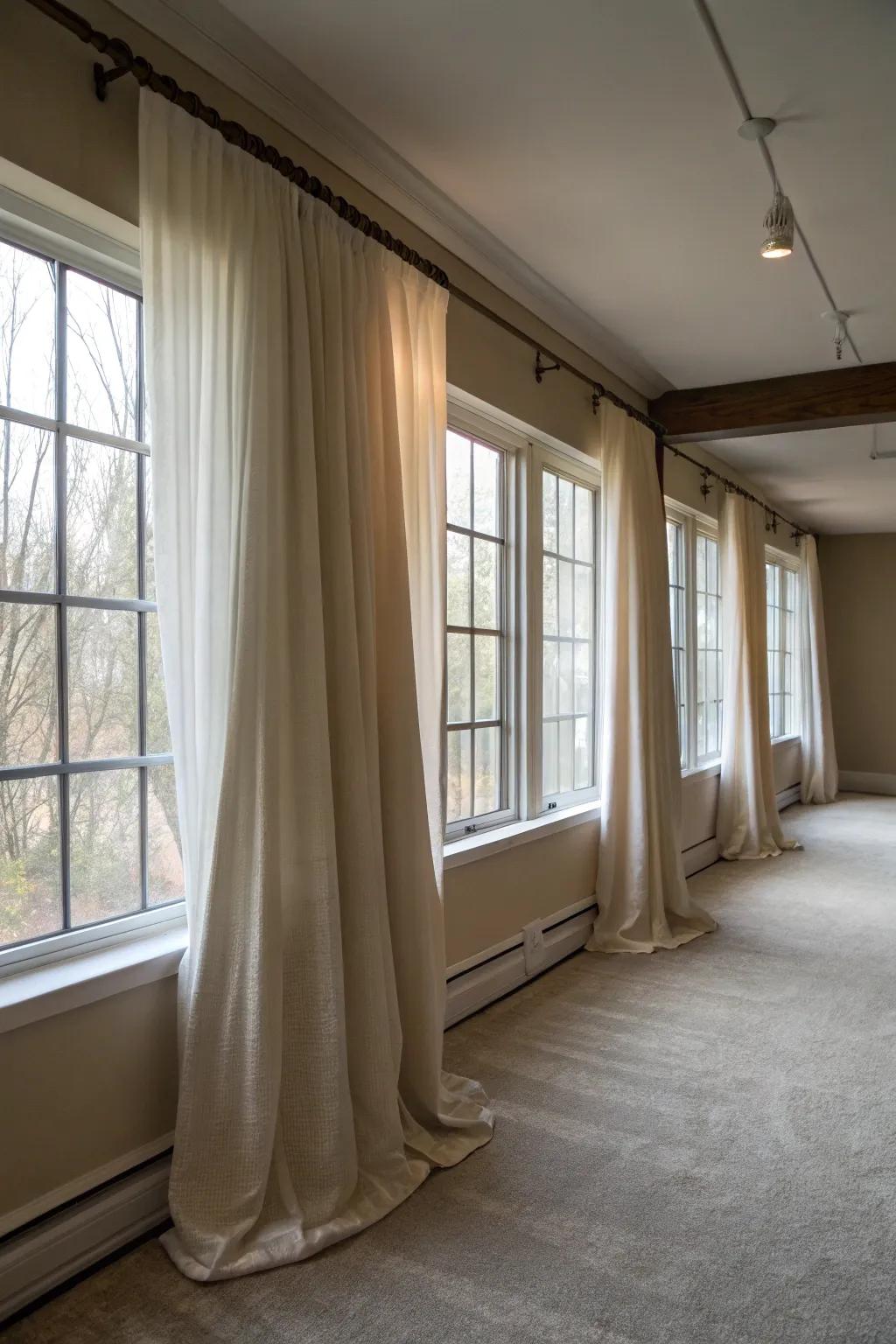Hanging curtains strategically creates the appearance of larger windows.