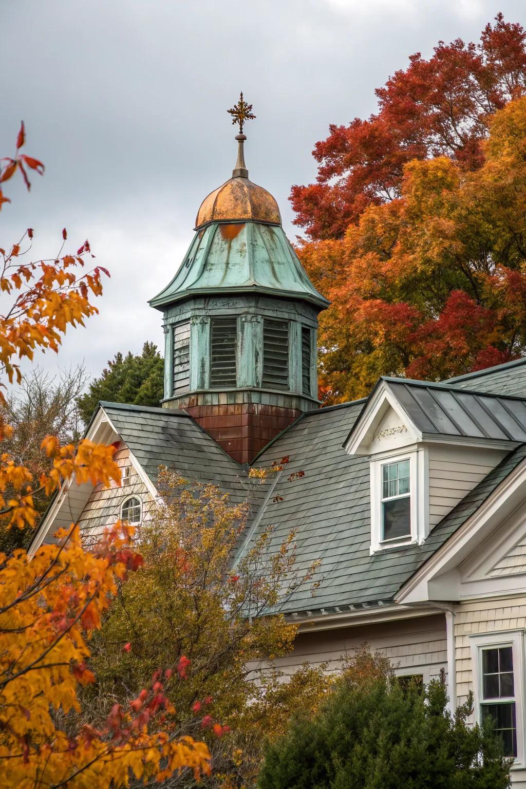 A house featuring a copper cupola with a stunning patina.