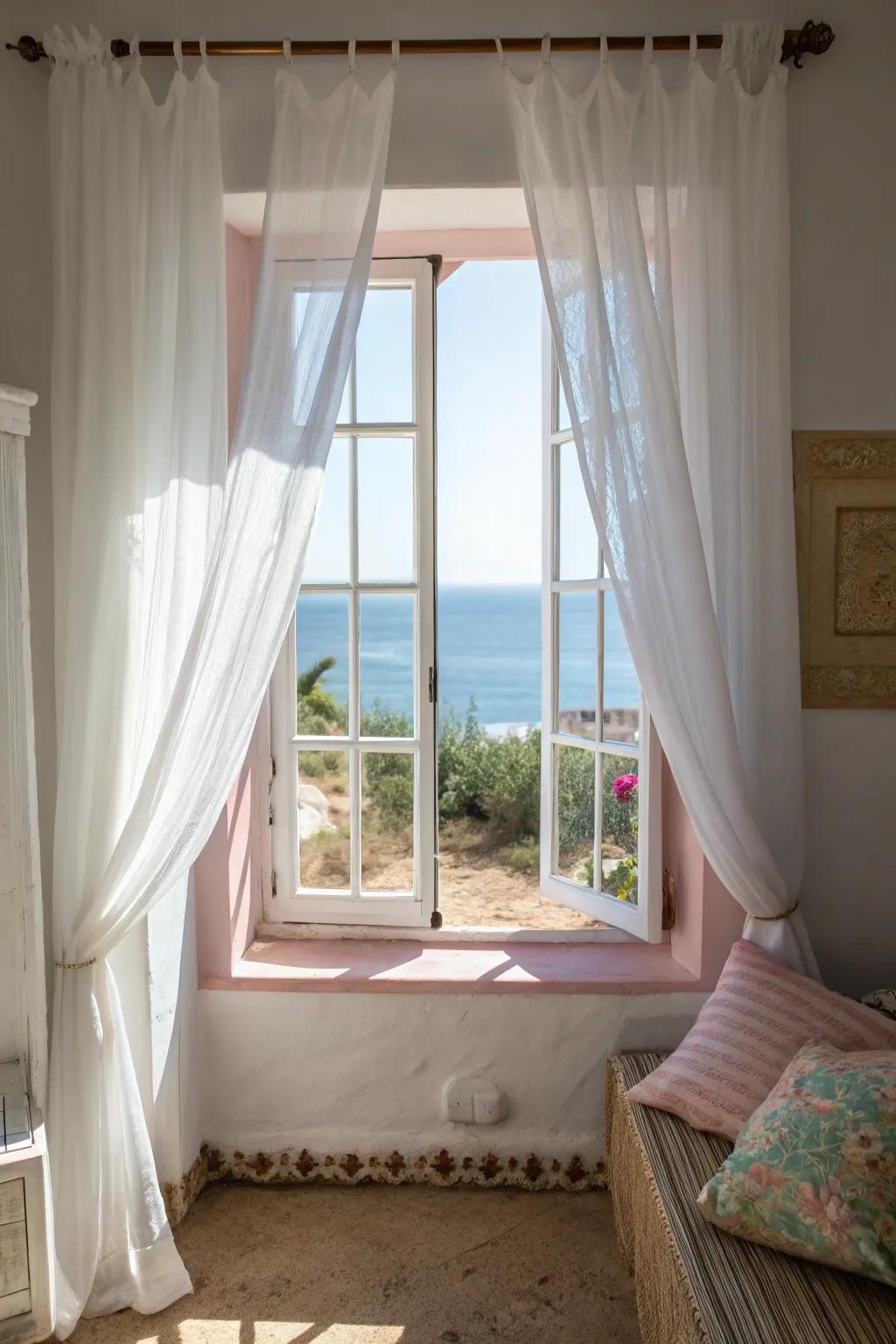 White curtains amplify sunlight, crafting a bright and open feel.