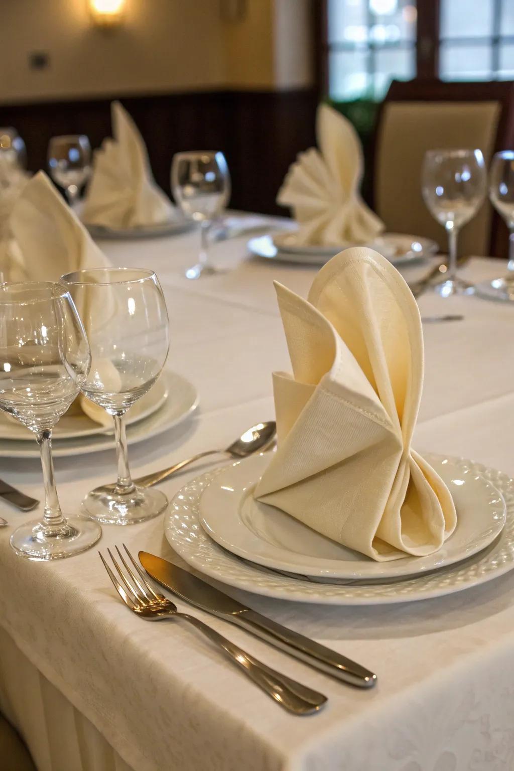 Innovative napkin folds contribute a trace of style to each place setting.
