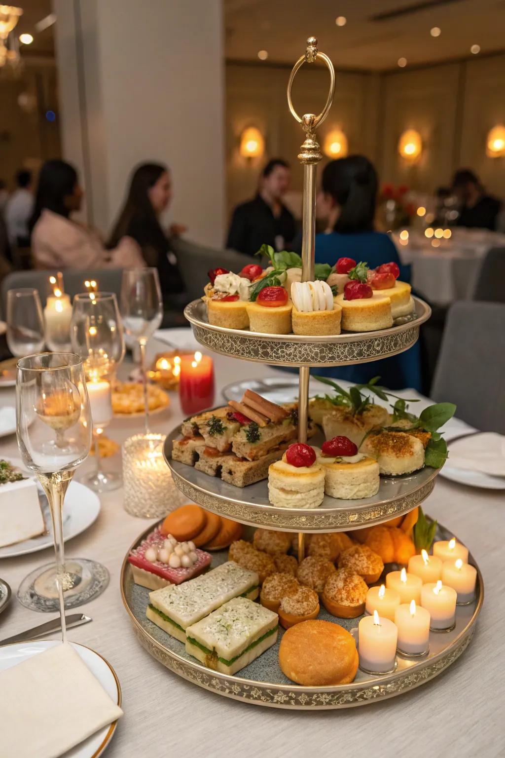 A dining surface ready for a gathering, showcasing a multi-level snack tray.