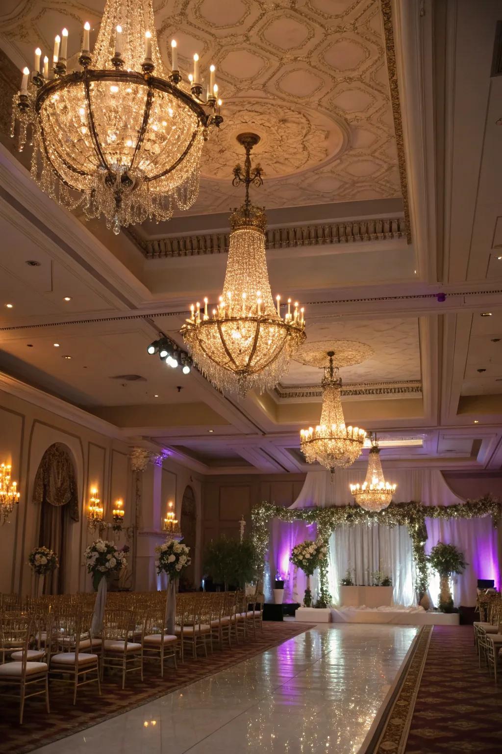 A wedding venue showcasing refined lighting designs with overhead fixtures and floor lighting.