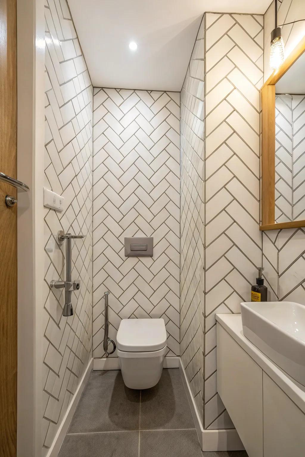 The eye is drawn upward by upright zigzag layout tiles, which add a sense of height and spaciousness to this small bathroom.