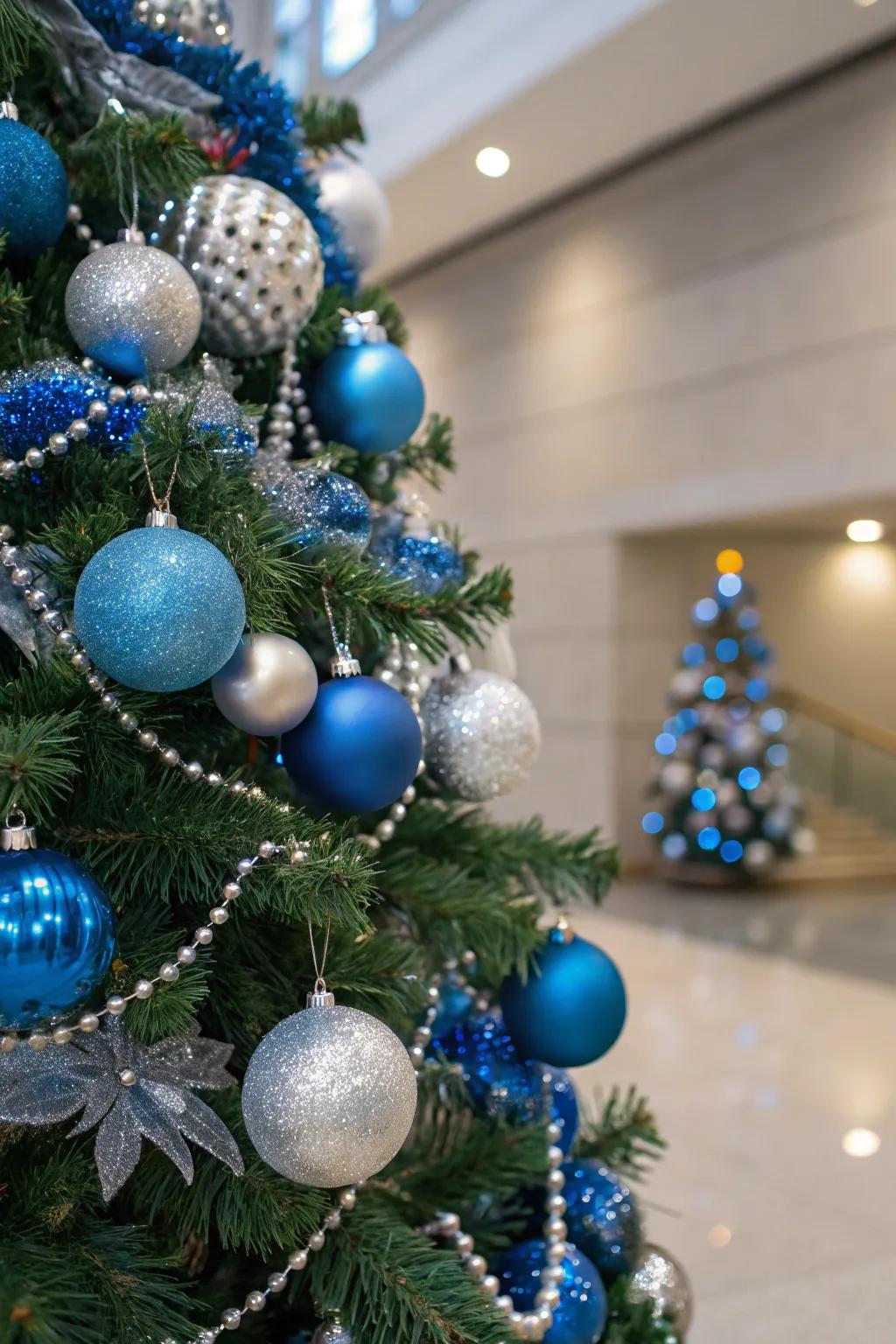 A breathtaking singular-tone themed holiday tree showcasing azure and shimmering accessories.