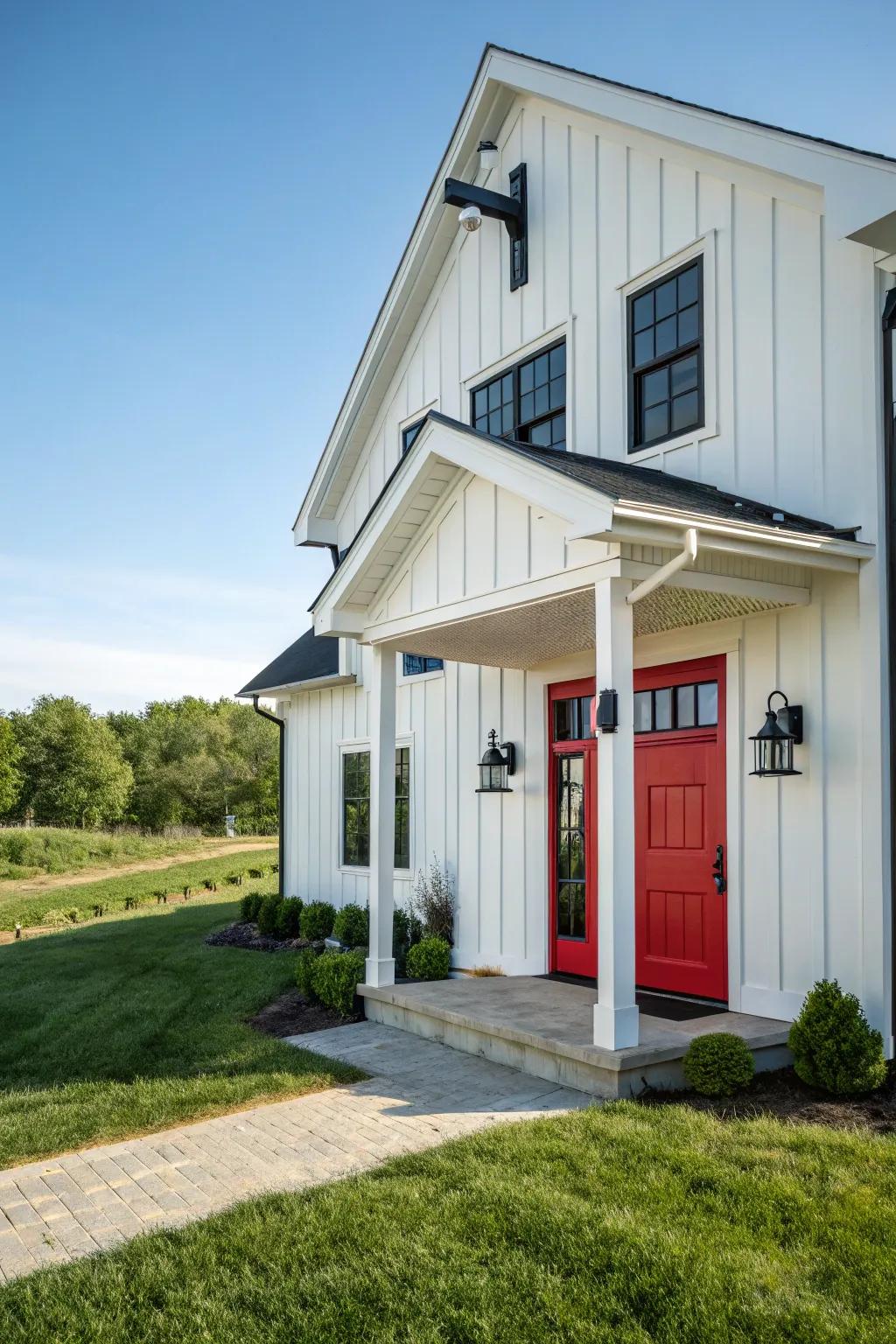 Modern farmhouse with a crimson door, blending tradition with modernity.