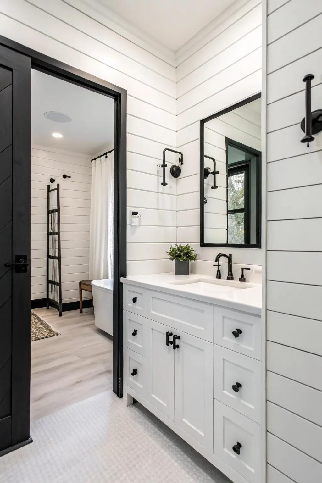 A monochrome bathroom featuring white paneling for a textured look.
