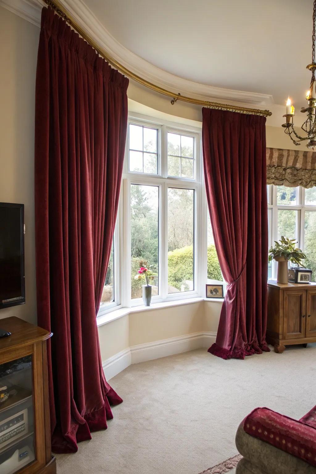 Velvet window coverings convey a luxurious and lavish atmosphere to bay windows.