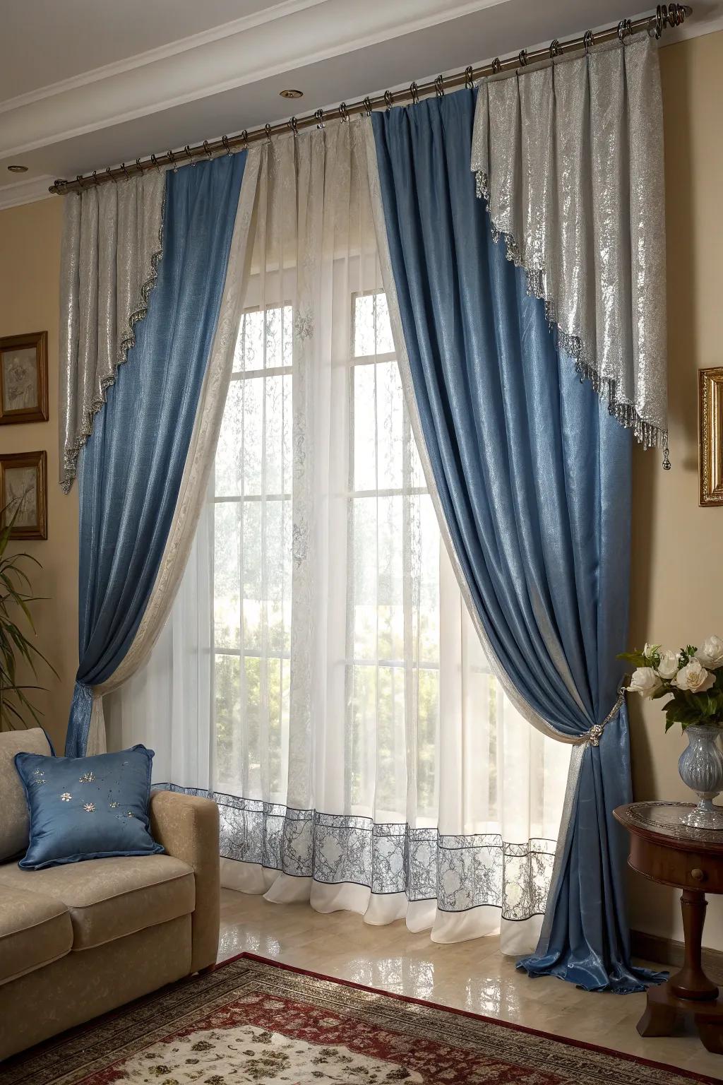 Blue and silver window hangings add height and drama to this elegant living room.
