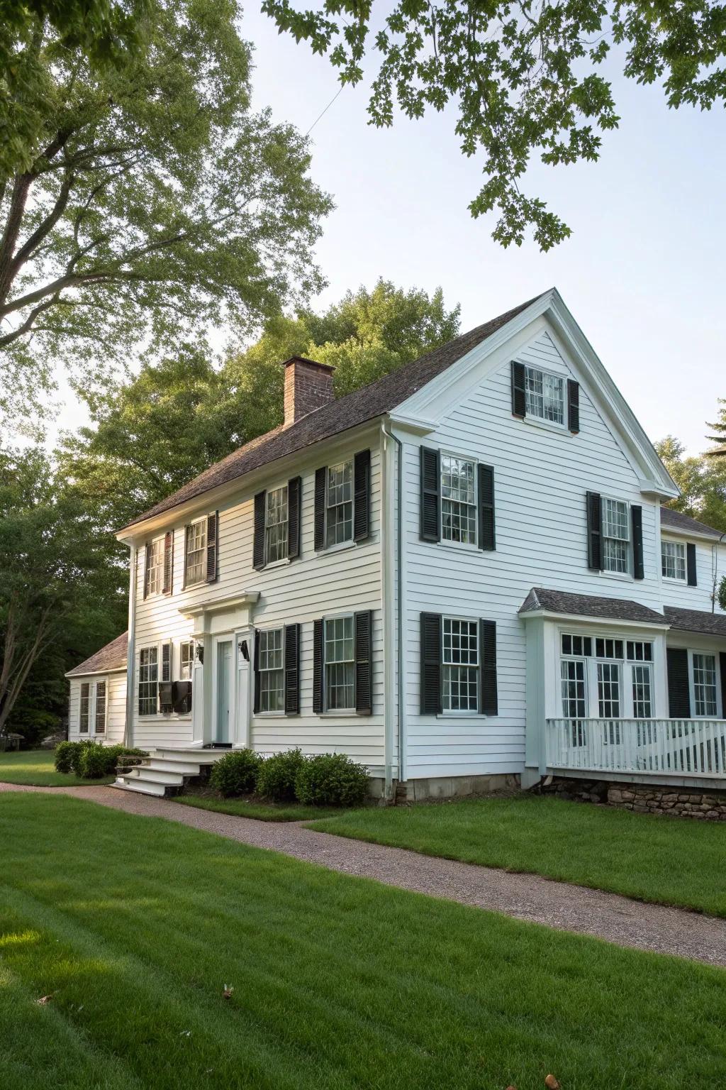 Colonial residence featuring upright board-and-batten siding.
