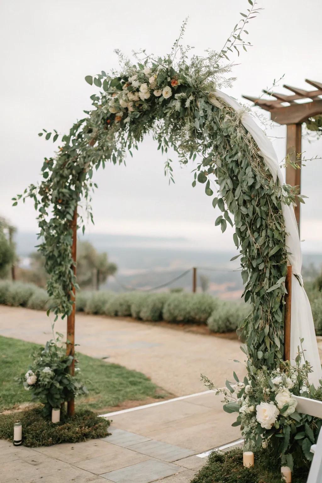 A lavish eucalyptus arch that contributes elegance to any garden wedding.