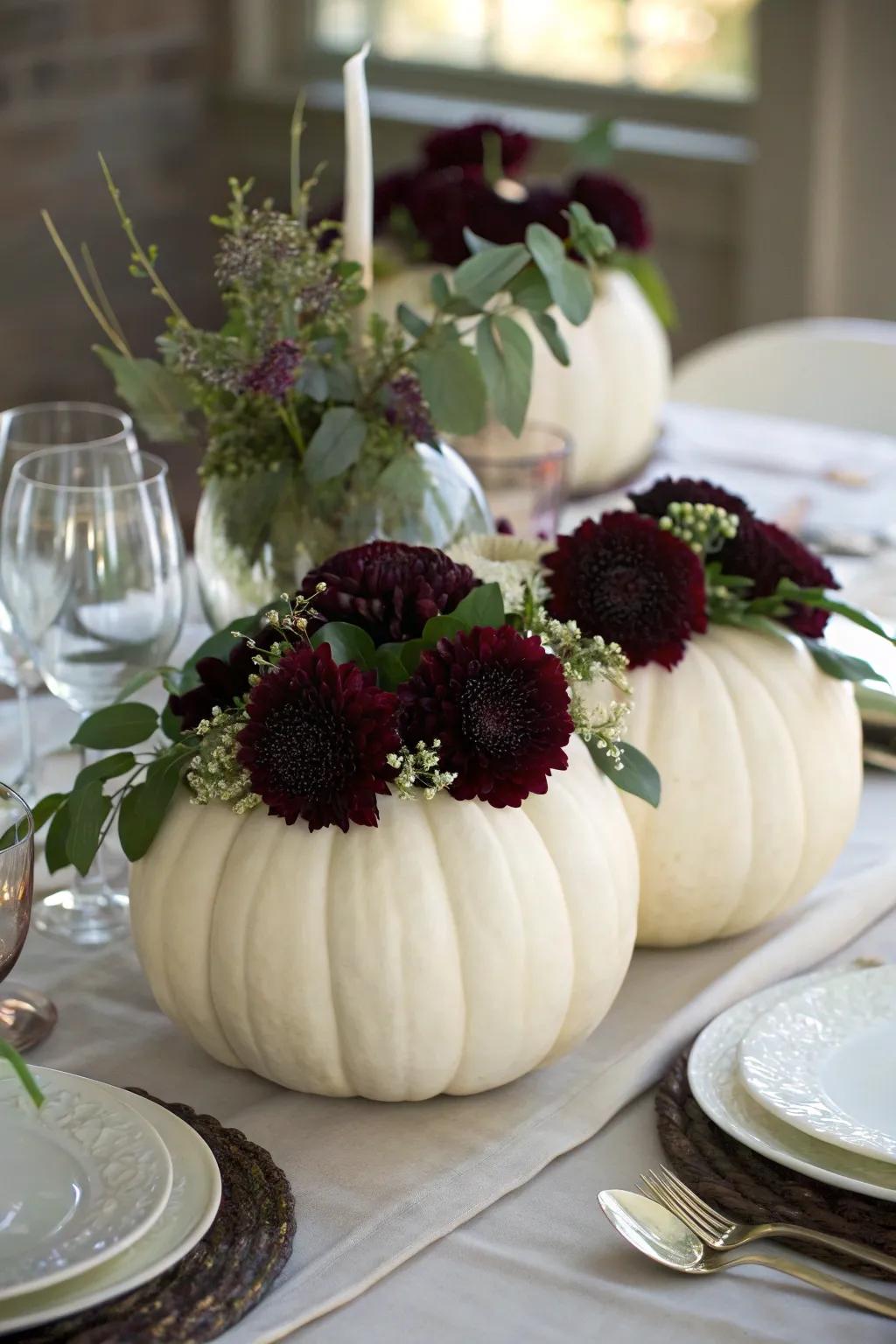 Snow-white gourds filled with flowers create a distinctive, thematic centerpiece.