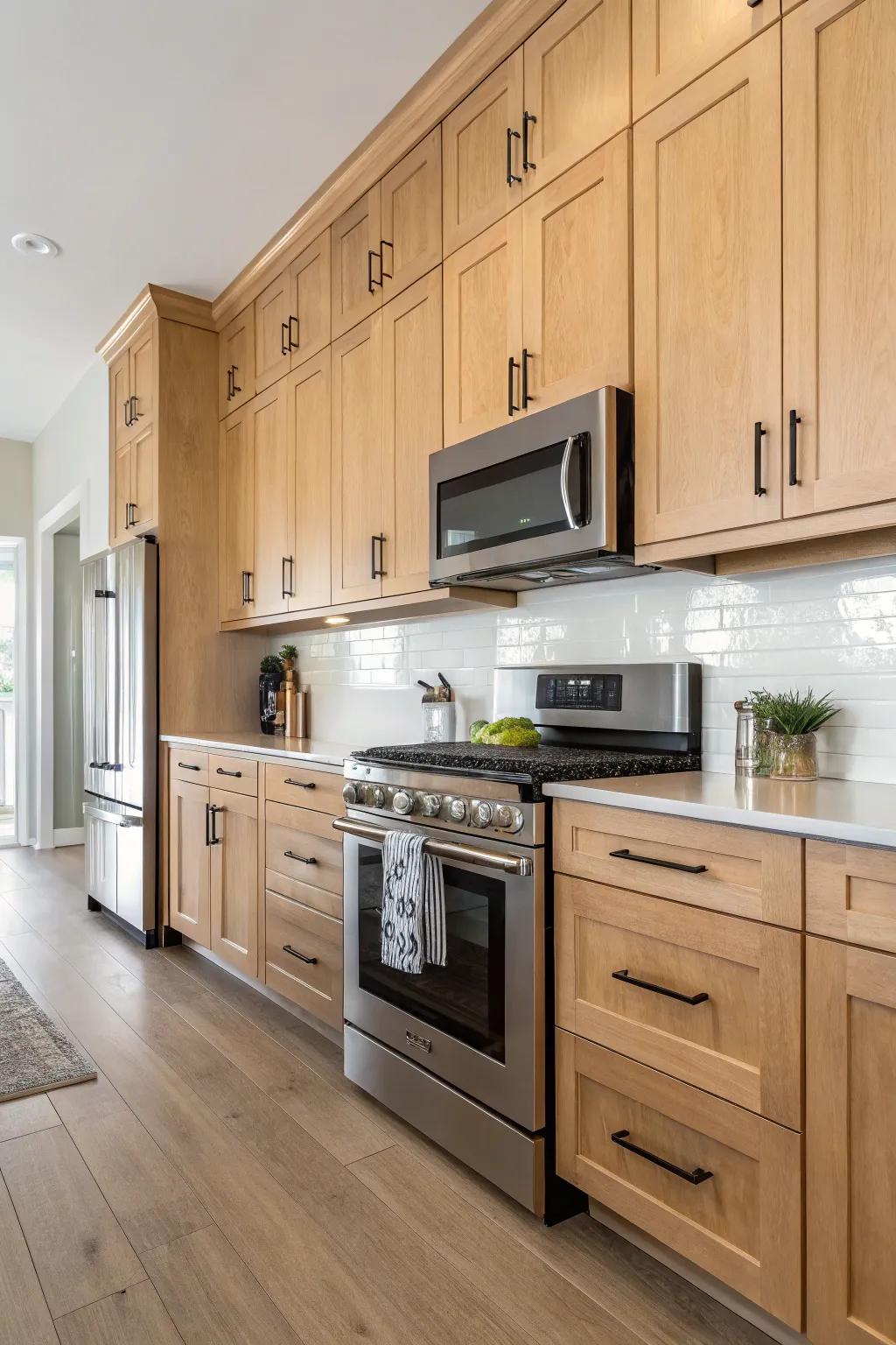 Streamlined hardware imparts a contemporary touch to light oak cabinets.