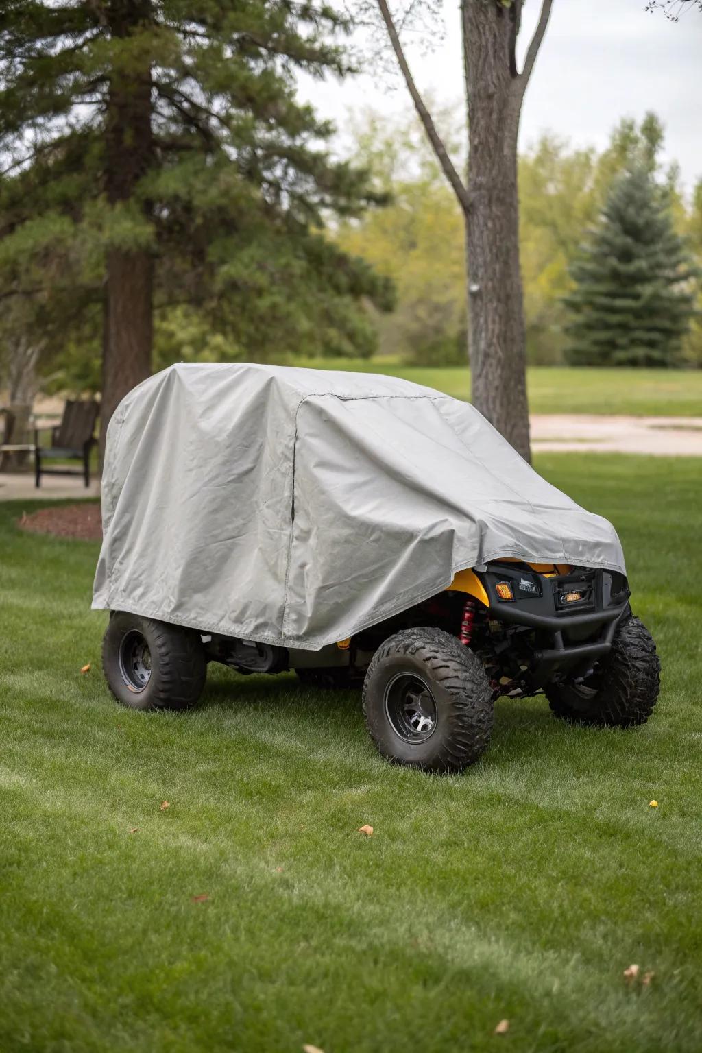 Fitted covers protecting outdoor-stored electric ride-ons.