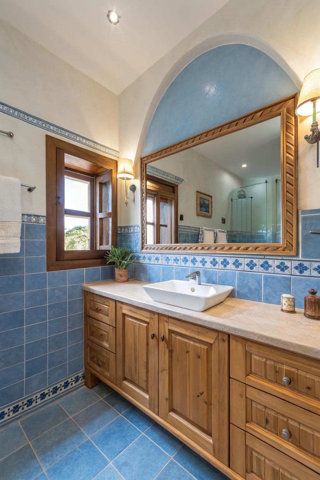 Blue and wood elements fashion a warm and inviting bathroom.