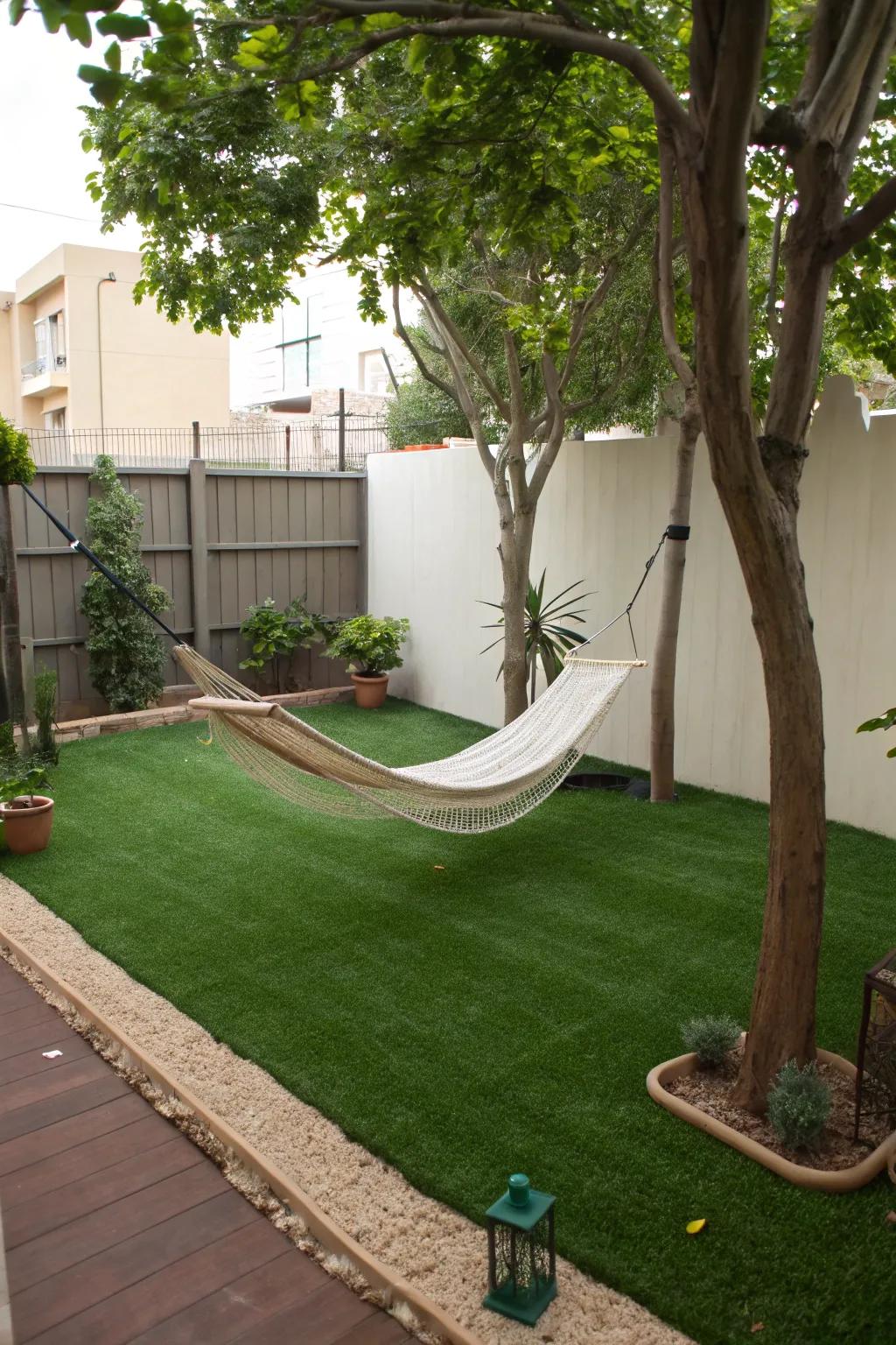 A hammock hideaway for relaxation over synthetic turf.