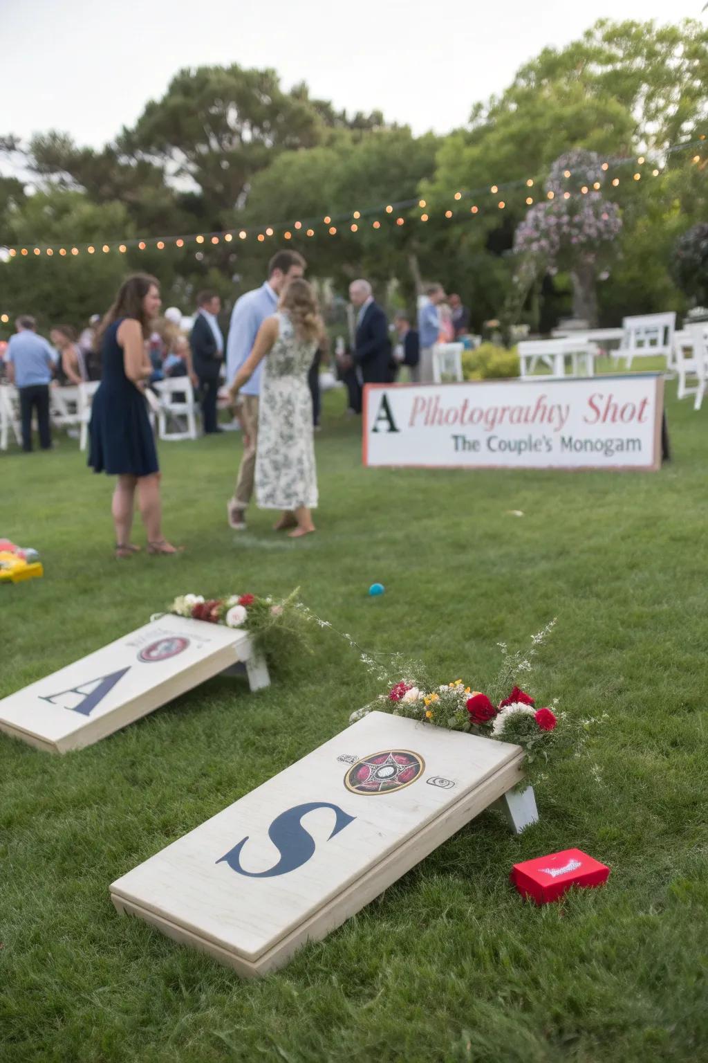 Customized lawn games at a wedding, presenting the couple's emblem and themed hues.
