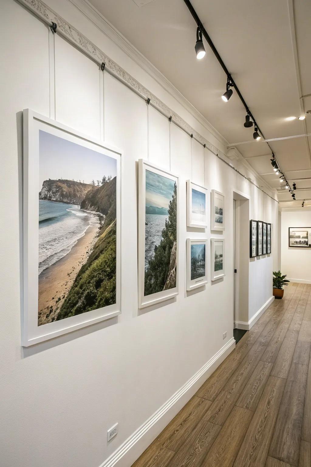 Art prints seemingly levitating on the wall using concealed mounts.
