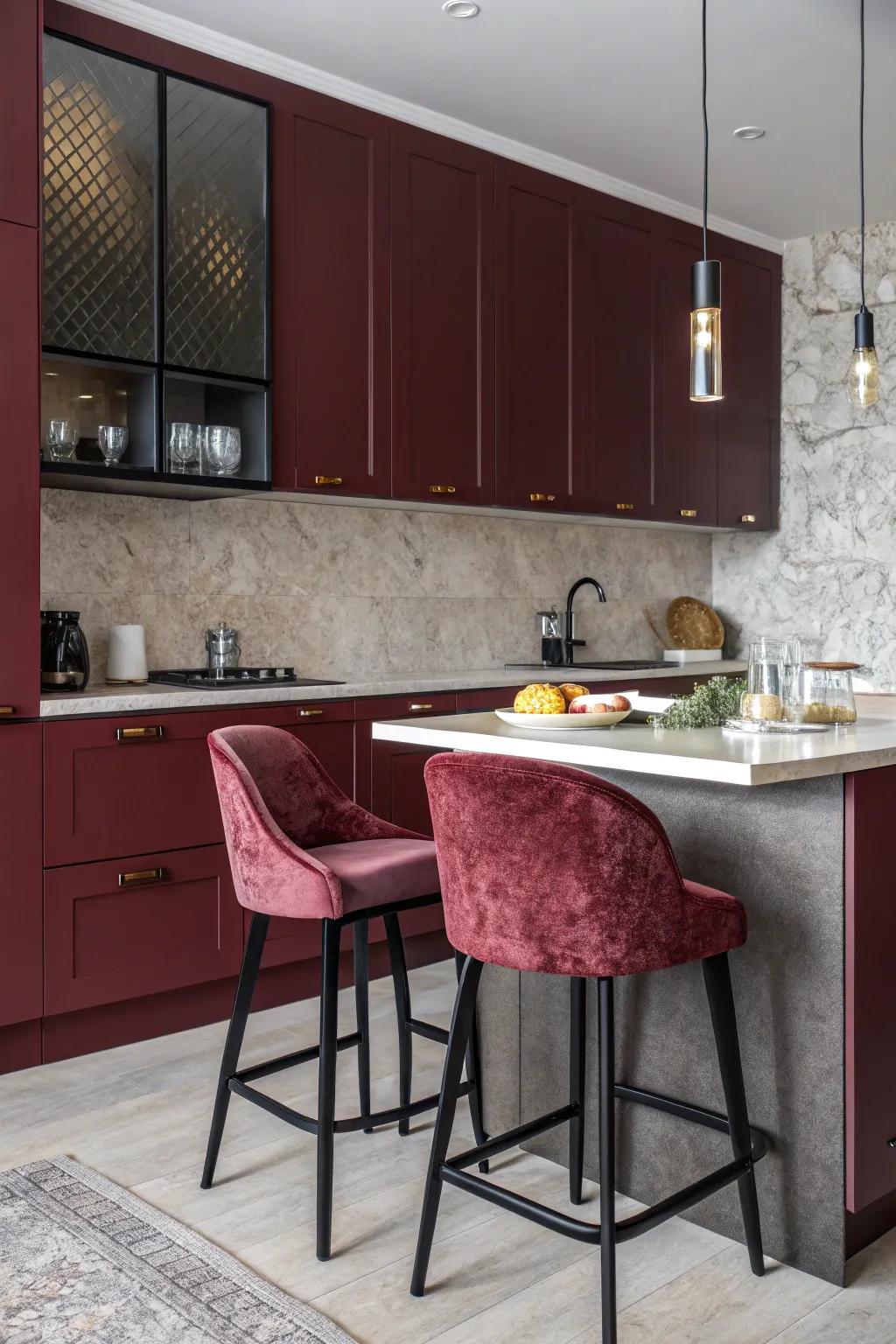 Elegant kitchen featuring dark red cabinets and velvet textures.