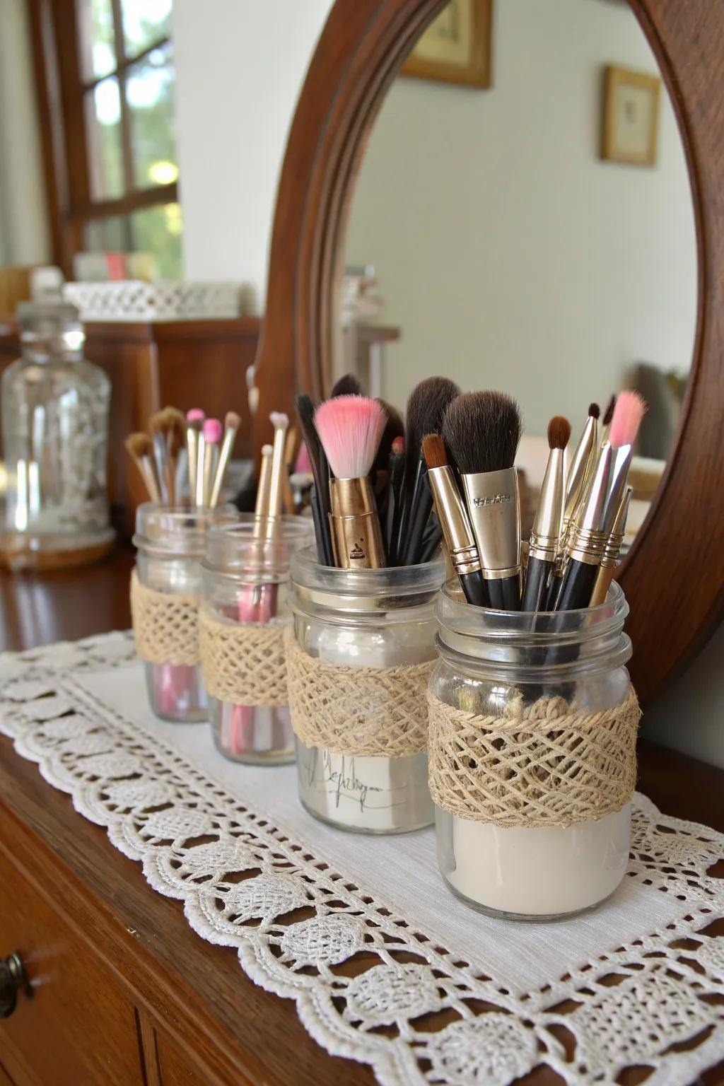 Artisan glass jars draw shabby chic elegance to the conservation of makeup brushes.
