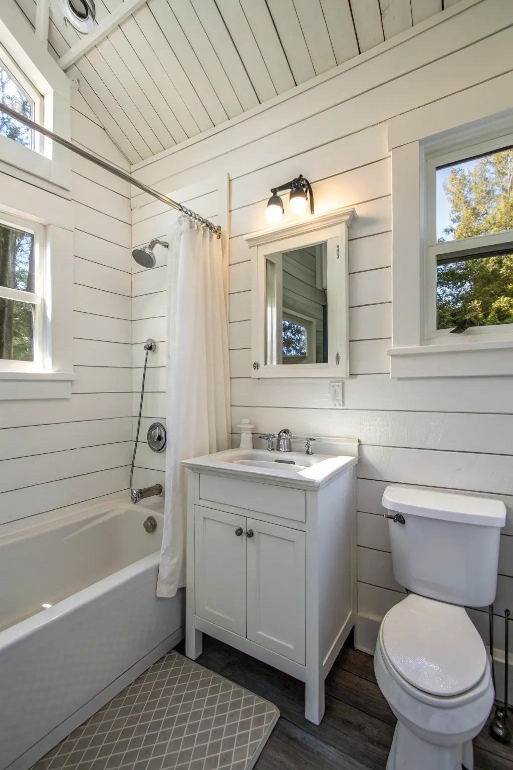A small bathroom featuring white paneling for added charm.