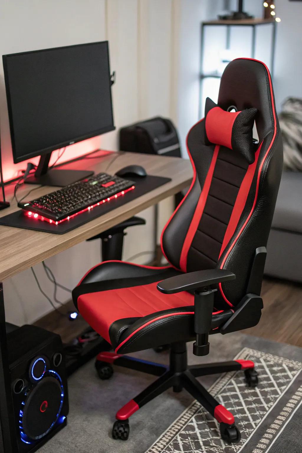 A polished black and scarlet comfort seating awaits action within a gaming arrangement.