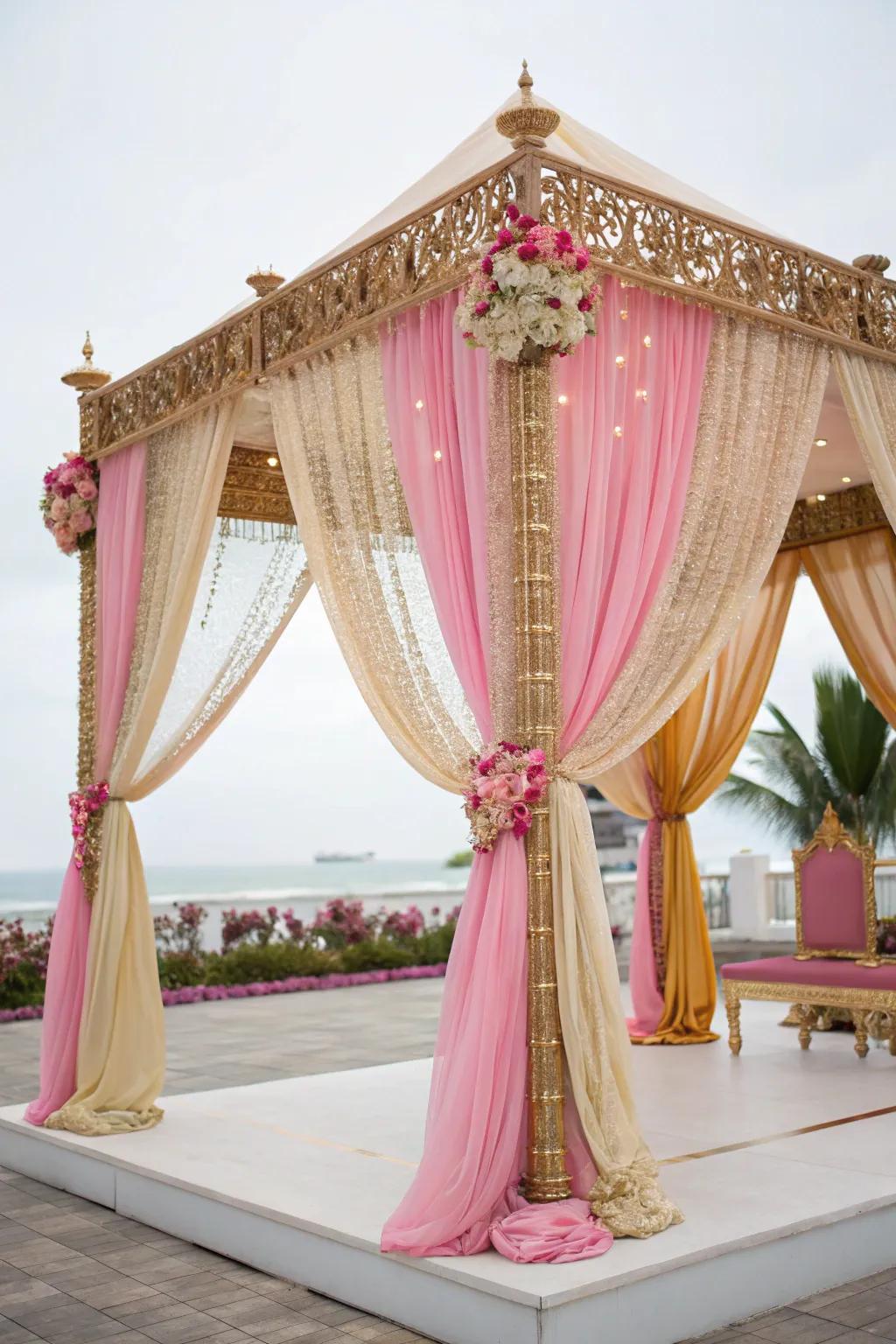 Lavish cloths of rose and gold elegantly enshrouding a mandap.
