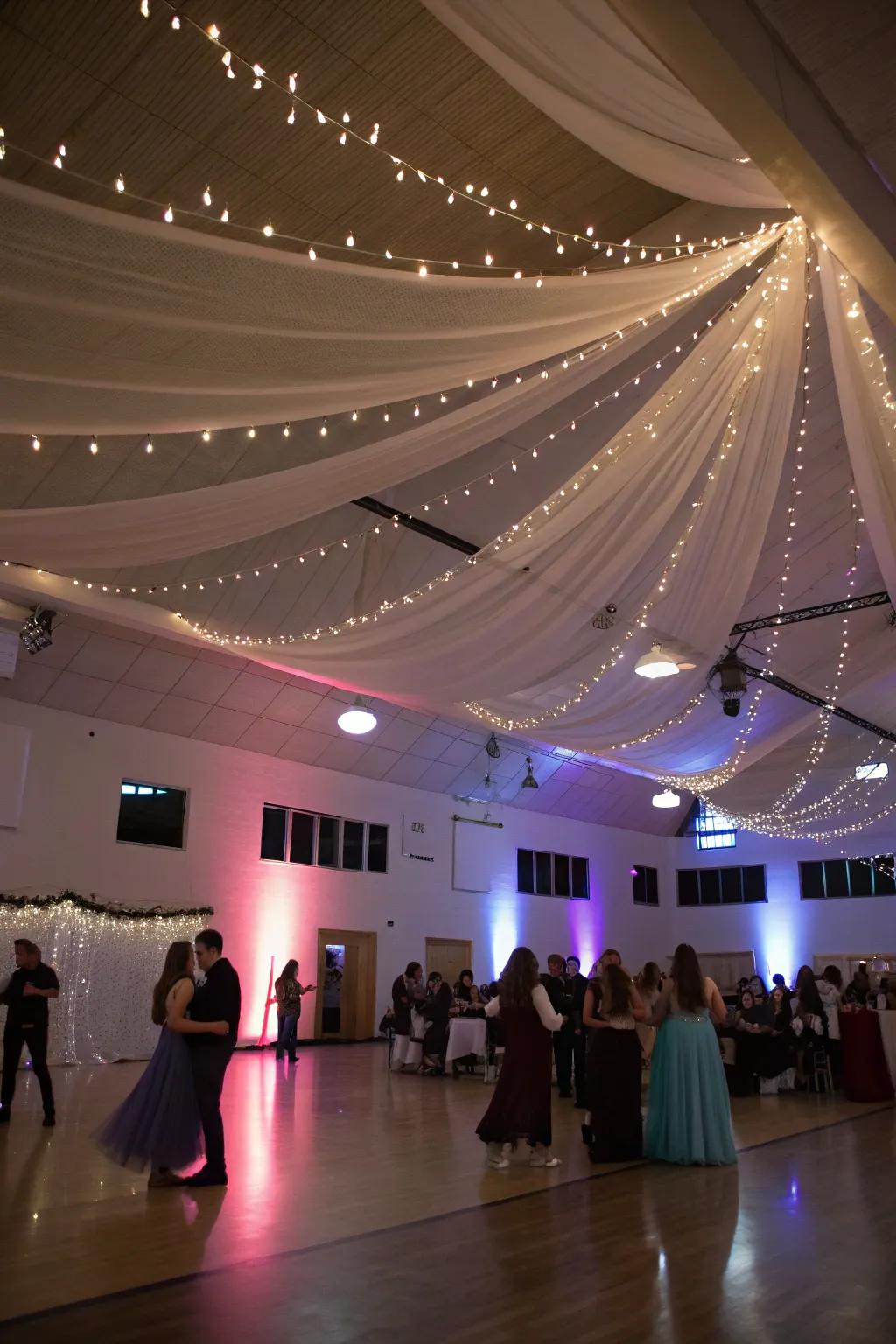 A ceiling exquisitely adorned with drapery and fairy lights.