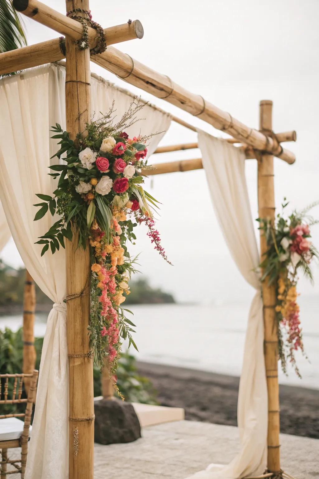 An elegant cane arch gently draped with flowers and cloth.