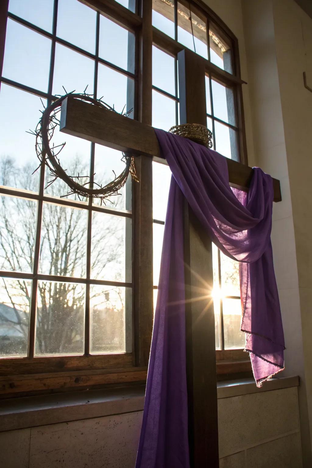 Cross adorned with a garland of spines and violet textile