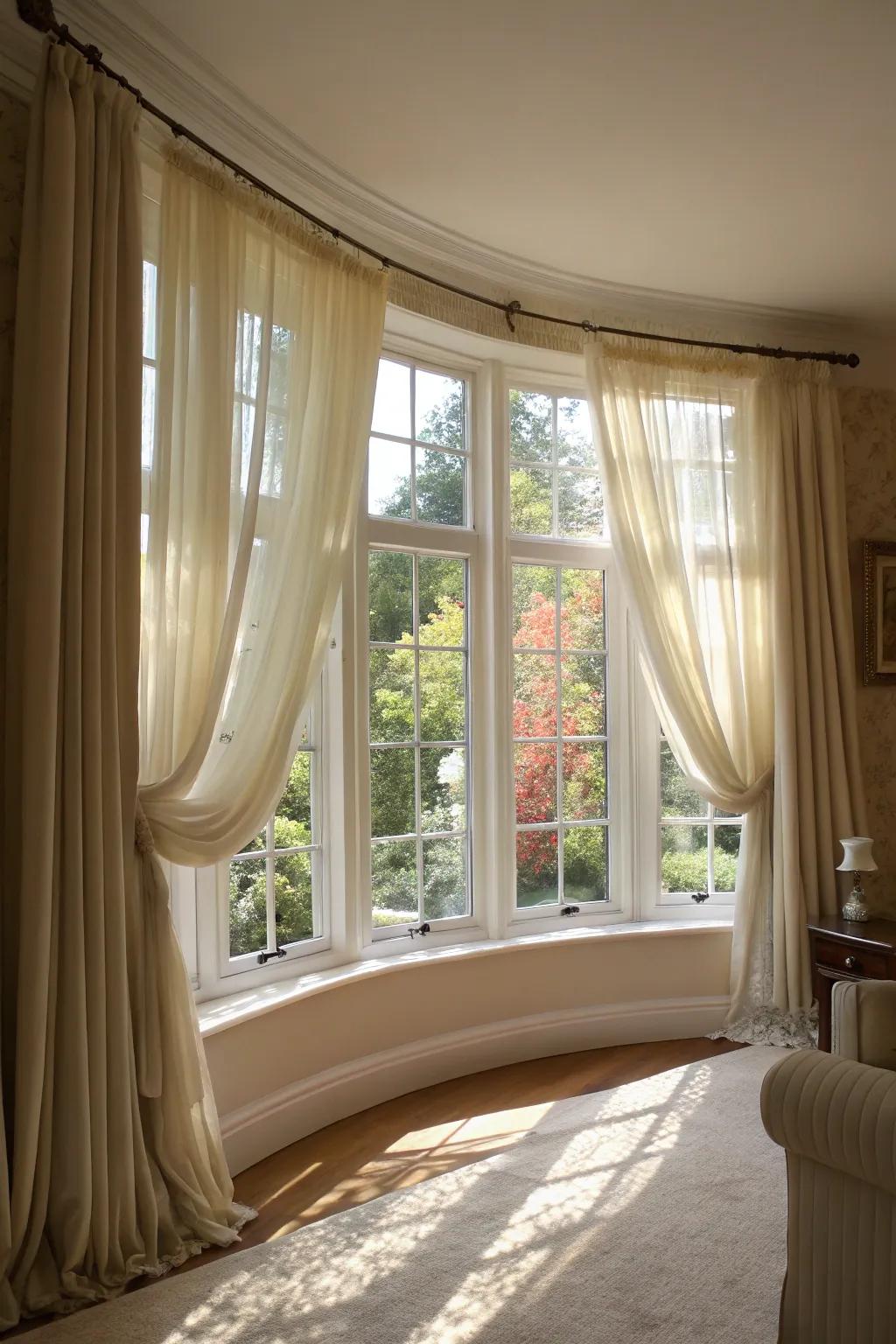 See-through curtains amplifying the natural light within a curved bay window.