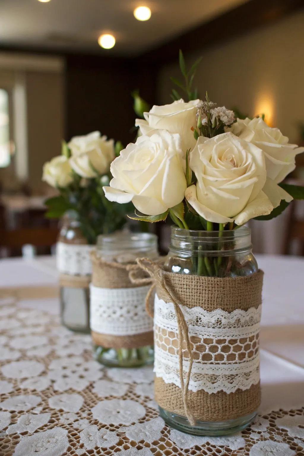 Tasteful mason jars adorned with sackcloth and filament.