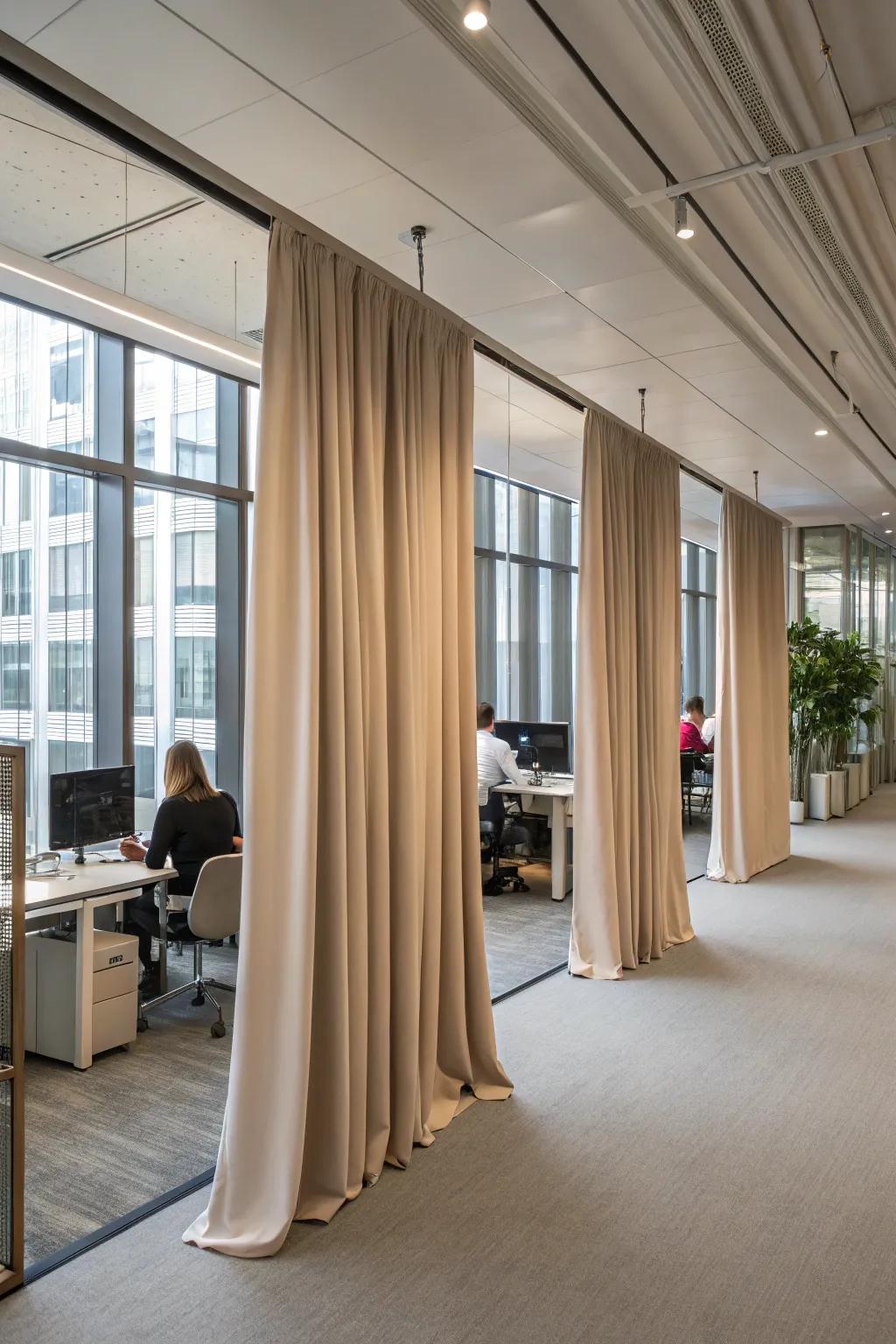 Drapery partitions infuse softness and versatility into office configurations.