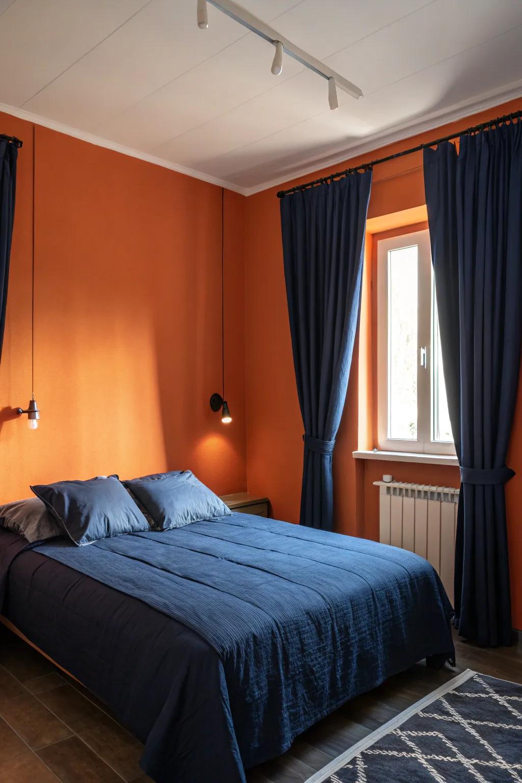 Navy accents deliver a comforting comparison against striking orange walls.