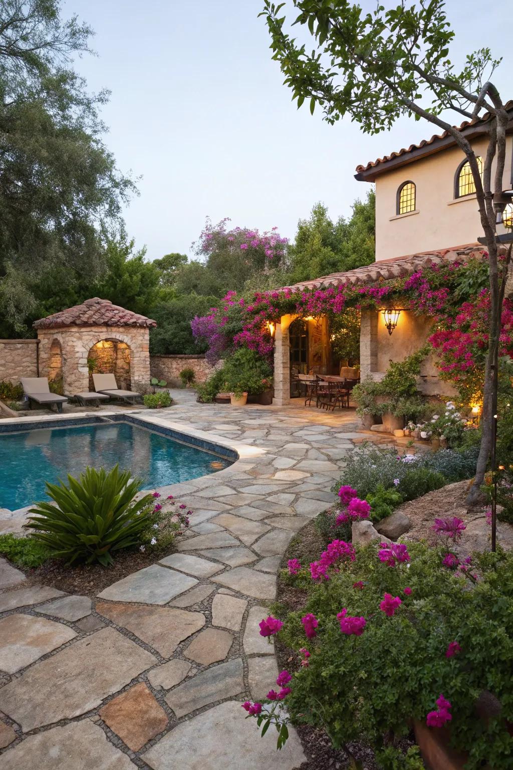 Organic rock terraces impart rustic charm to this Spanish-inspired pool setting.