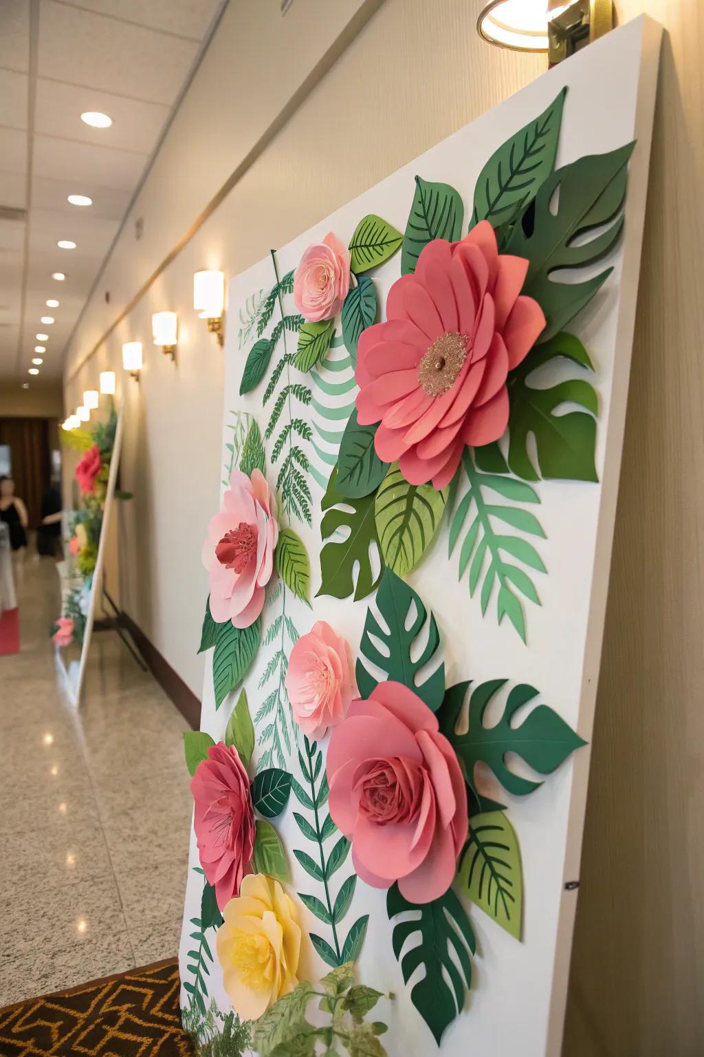 A bulletin board bedecked with oversized paper flowers and opulent green leaves.
