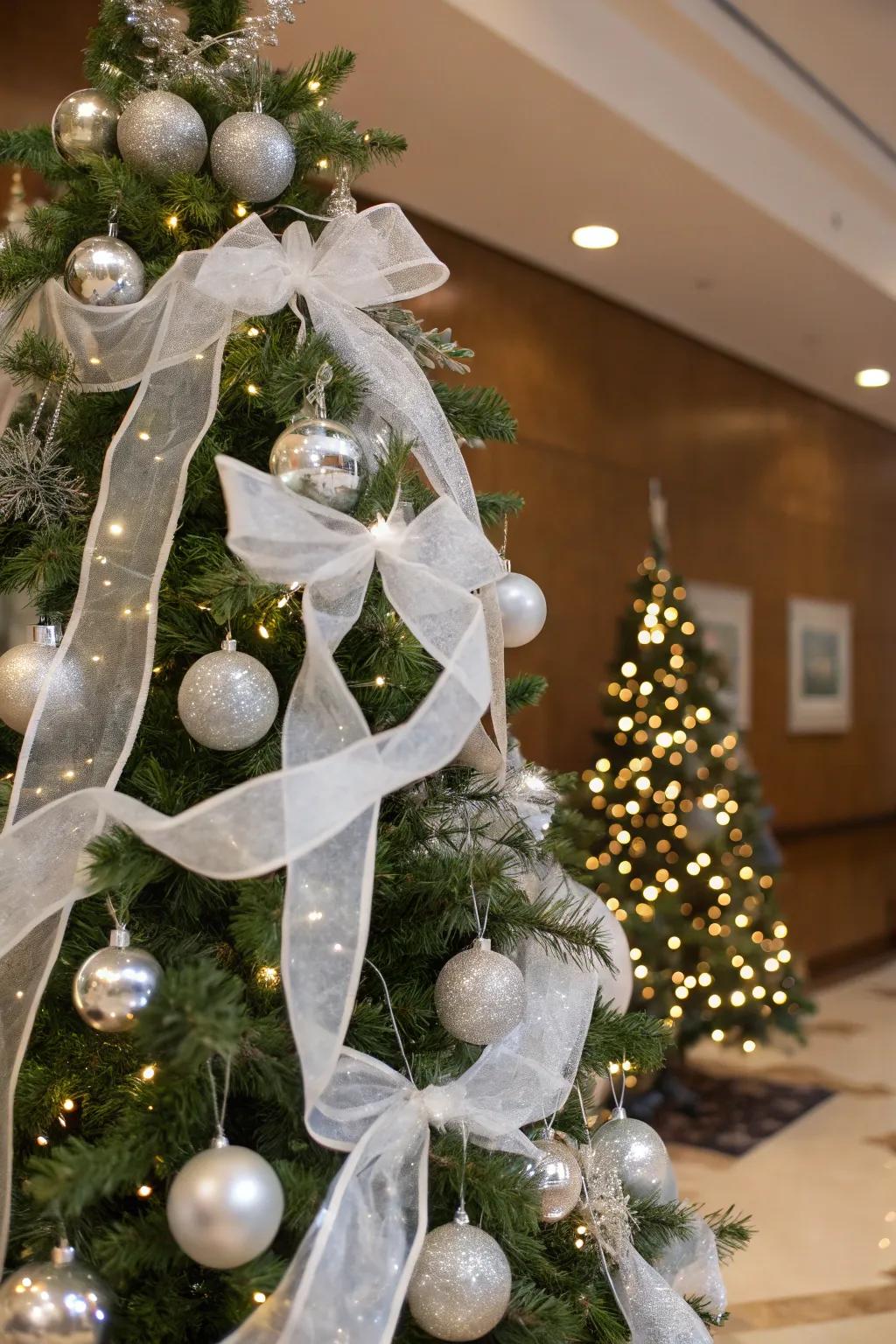 White ribbons contribute a gentle, refined aesthetic to the tree.